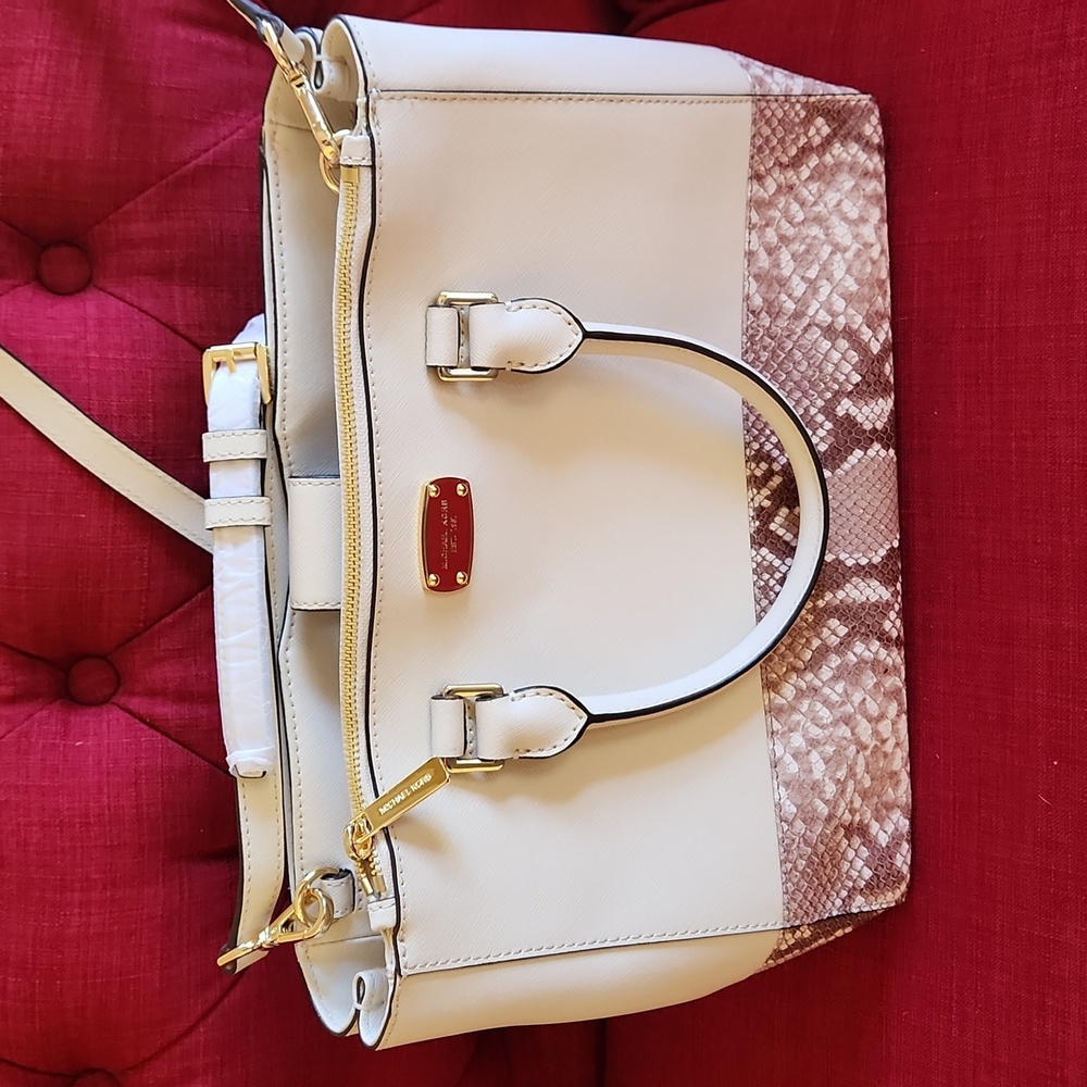 NWOT but still has the tissue over hardware Michael Kors GORGEOUS cream w/python
